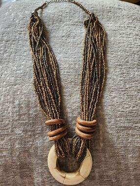 Multi-Strand Bead Necklace with Cream Pendant